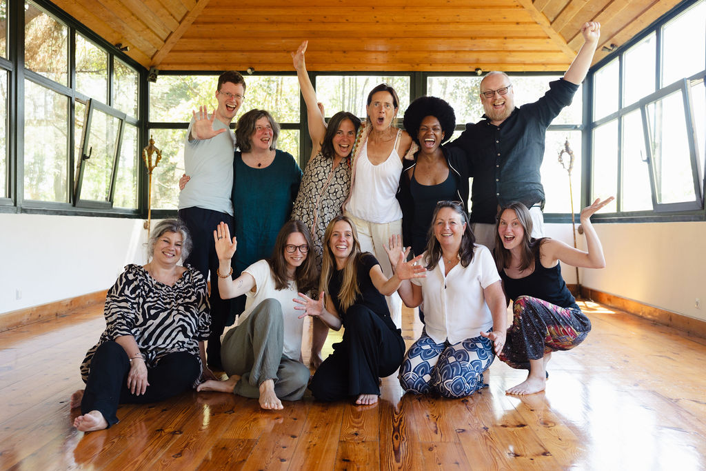 Relinde Moors with a group of clients celebrating in a sunlit retreat studio
