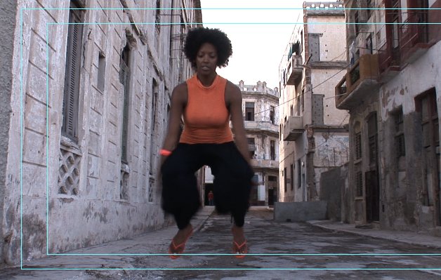 Relinde Moors dancing mid-jump in a Havana street